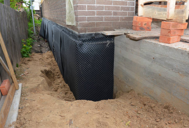 Happy homeowners after waterproofing job in Allred